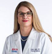 Kristi Clark, MD at HealthTexas in white lab coat