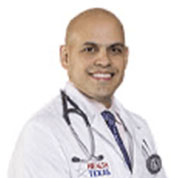 Ricardo Arevalo, MD in a white coat