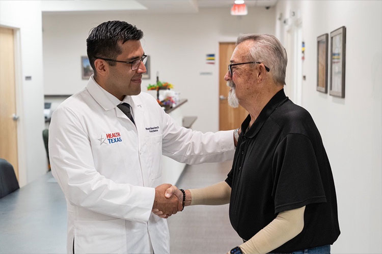 V Alvarez with patient at HealthTexas.
